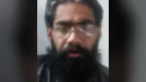 Since the accused is at large and could not be produced before it, the court allowed the prosecution's