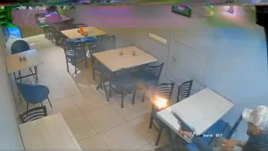Panic gripped a pizza outlet after unidentified assailants opened fire inside the eatery late at night