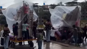 Several people were briefly trapped underneath the idol before local residents and fellow