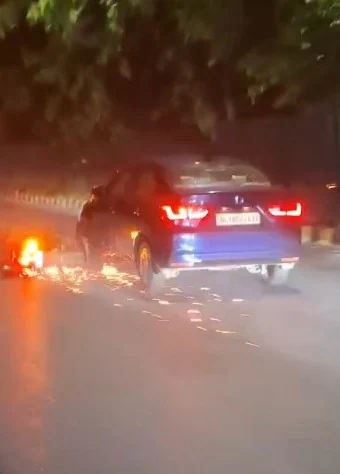 It is late Thursday night and a 73-year-old man drags a motorbike, sparking a shower of sparks