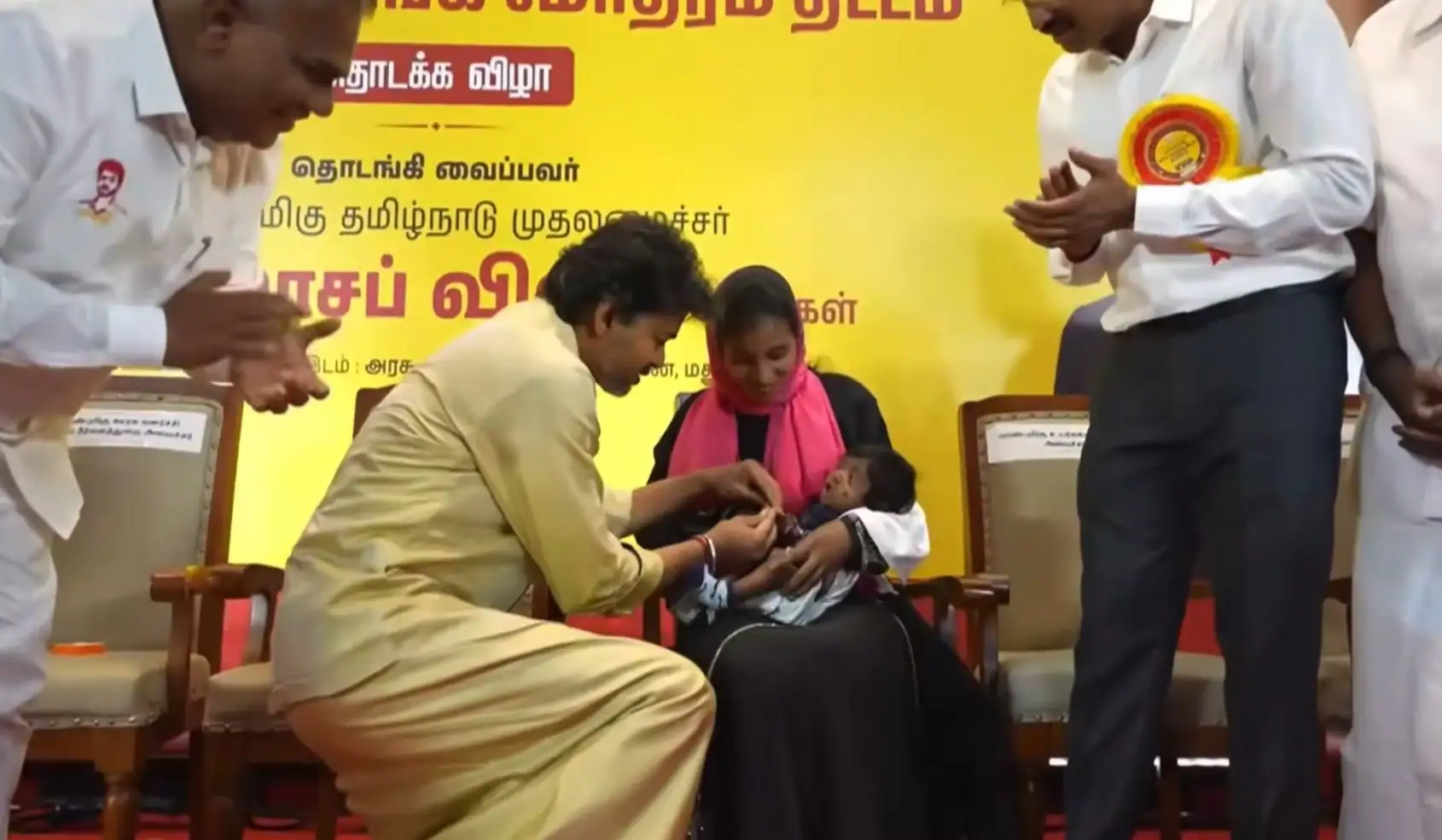 Rolling out the scheme at the Government Rajaji hospital, Vijay held the babies for a while