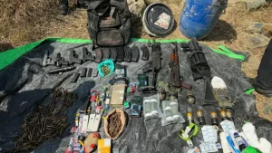 Security forces recovered a large cache of arms, ammunition, grenades and improvised explosive