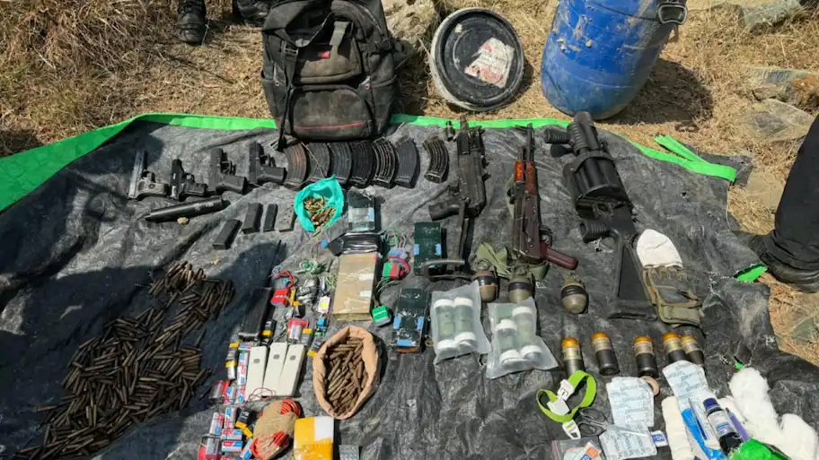 Security forces recovered a large cache of arms, ammunition, grenades and improvised explosive