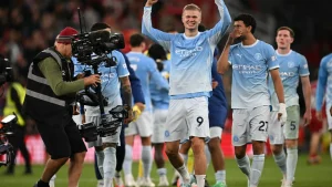 Manchester City shrugged off the threat of swingeing sanctions to beat 10-man Liverpool 3-0