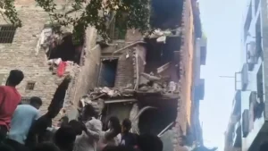 Many people are feared trapped under debris after part of a building collapsed in Delhi's